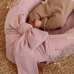 Discover our premium baby nest sleeper crafted with breathable linen and hypoallergenic fill. Provides a cozy, secure space for newborns.