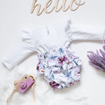 Shop our Floral Long Sleeve Onesie for babies. Soft, comfy, and stylish, perfect for playtime, naps, or everyday wear.