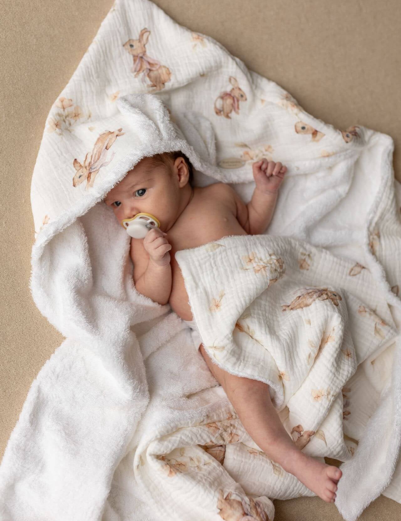 Wrap your baby in gentle comfort with our luxury bamboo baby towel. Made from bamboo terry and cotton muslin, it's hypoallergenic, and OEKO-TEX certified.