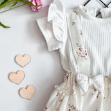 Soft and breathable, the Petal Bliss Short Sleeve Onesie keeps your baby comfy and cute. Ideal for everyday wear and special moments.
