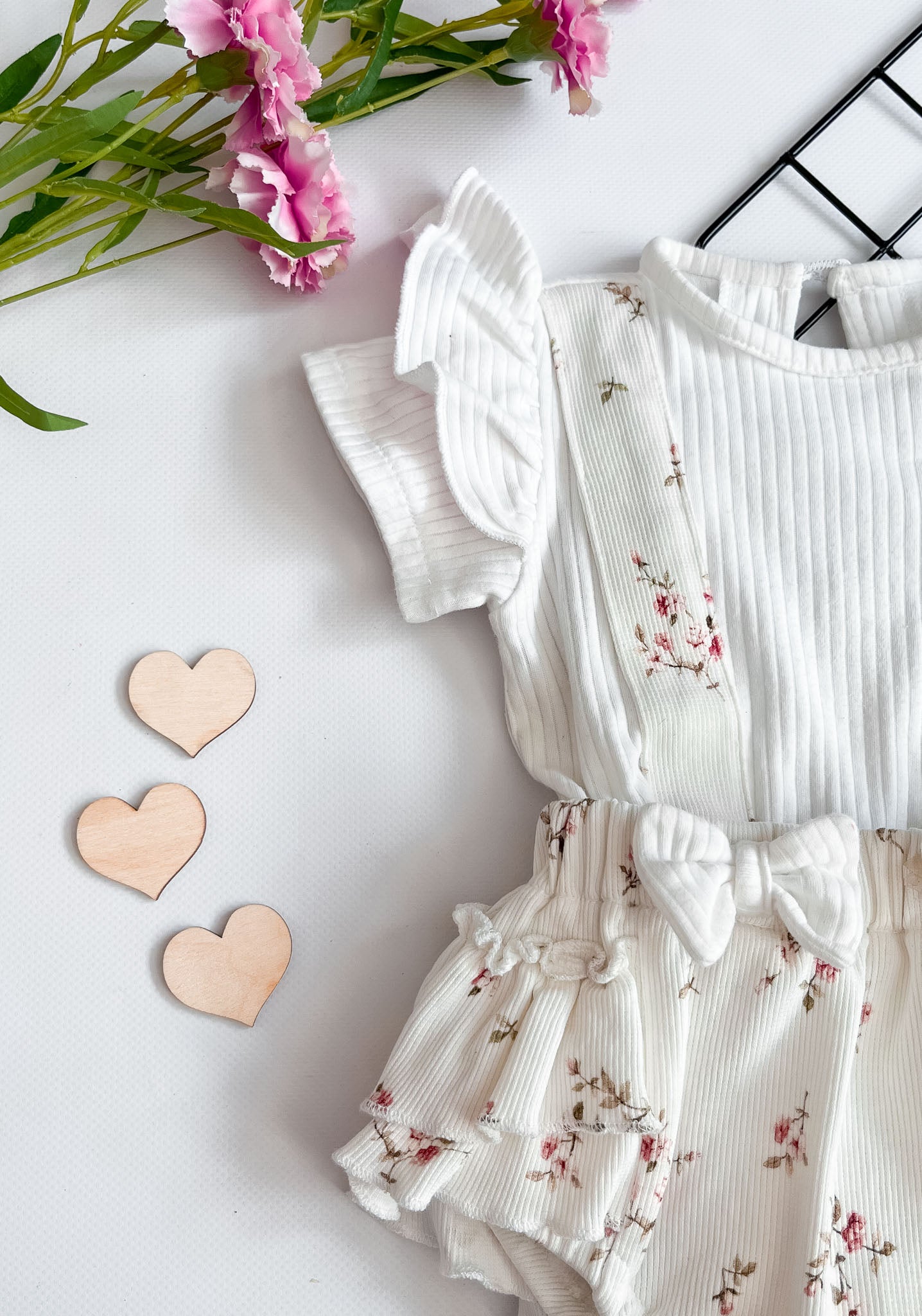 Soft and breathable, the Petal Bliss Short Sleeve Onesie keeps your baby comfy and cute. Ideal for everyday wear and special moments.