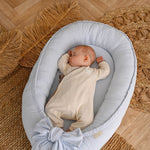 Discover our premium baby nest sleeper crafted with breathable linen and hypoallergenic fill. Provides a cozy, secure space for newborns.
