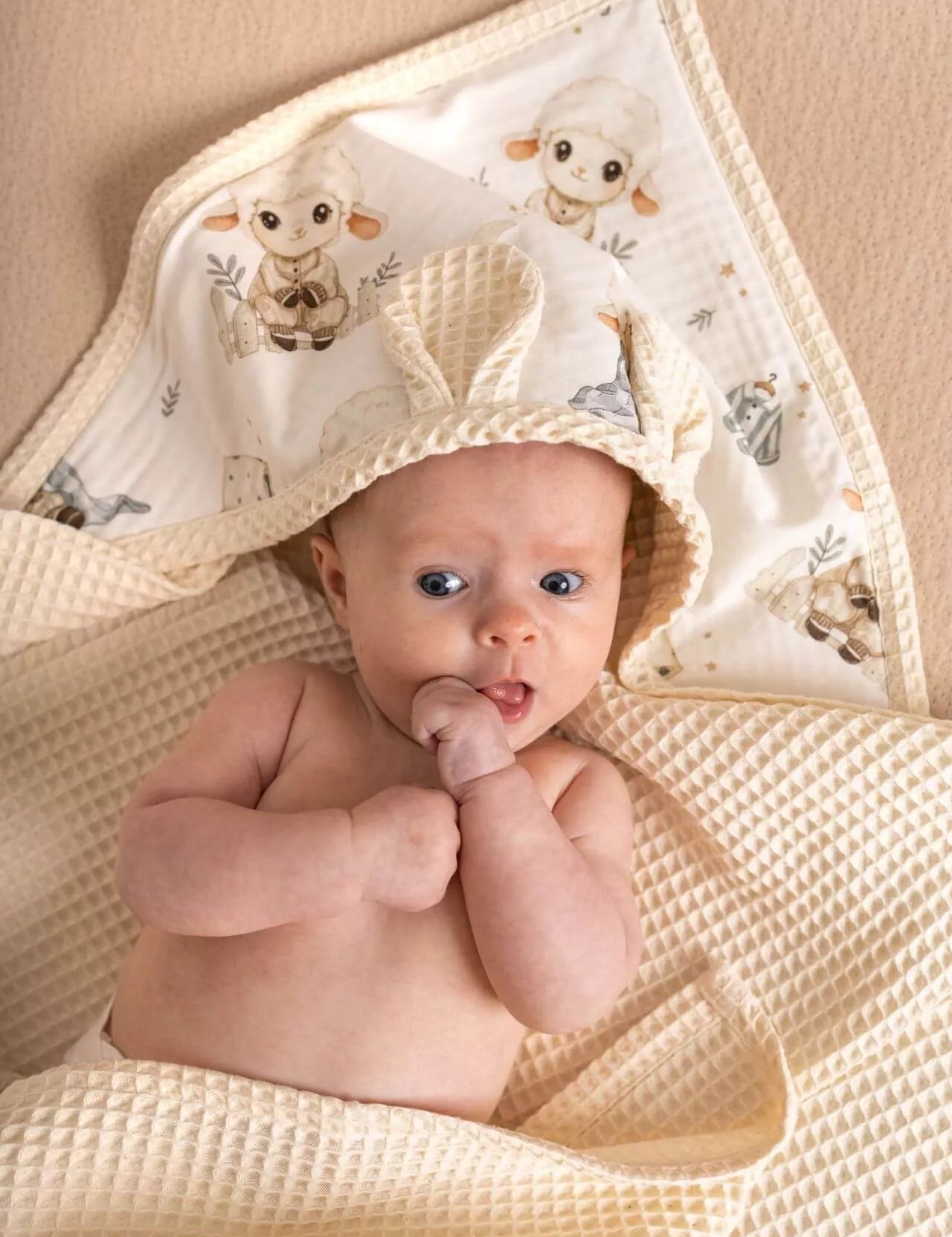 Wrap your little one in comfort with our Waffle Baby Hooded Bath Towel. Made from 100% natural cotton, it's ultra-soft, breathable, quick-drying.