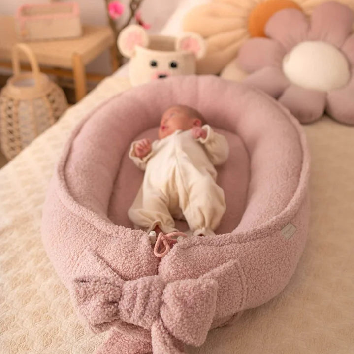 Cozy in Pink: Why a Snuggle Nest is a Newborn Essential