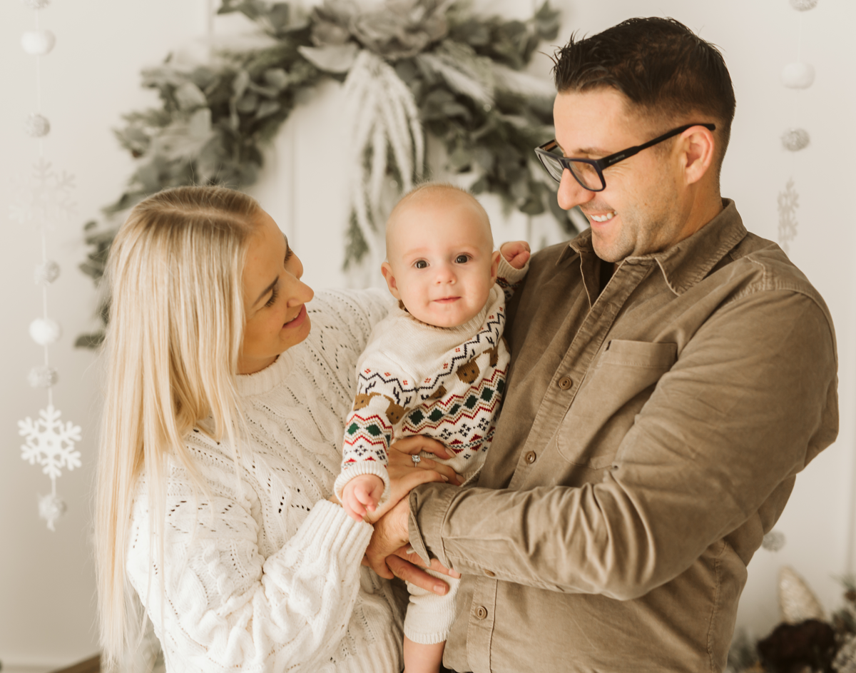 CocoMi founders Monika and Wiesiek holding their son Kacperek
