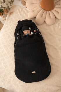 Keep your baby warm and snug with our 3-in-1 plush lamb footmuff. Soft, versatile, and perfect for strollers, car seats, or travel.