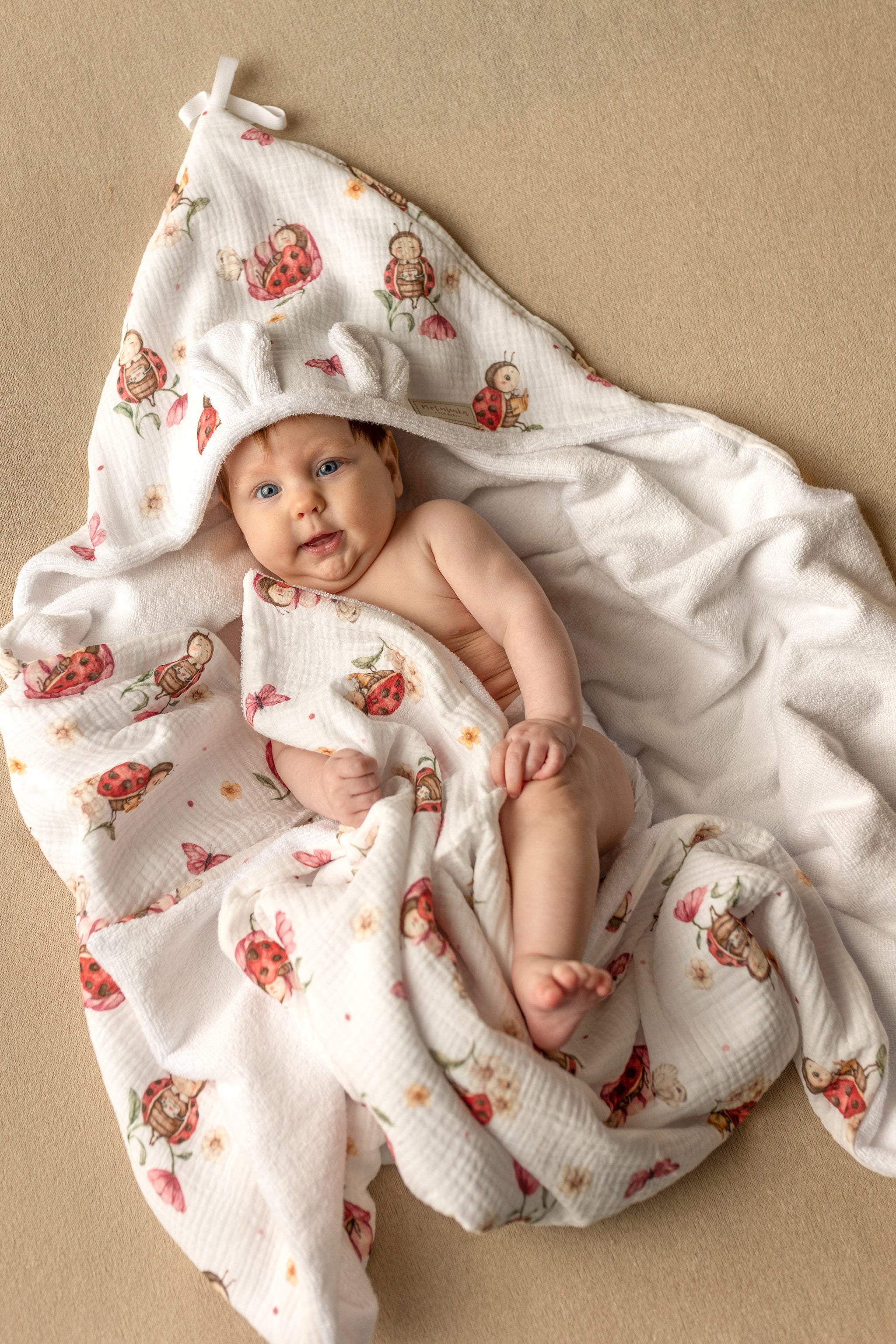 Wrap your baby in gentle comfort with our luxury bamboo baby towel. Made from bamboo terry and cotton muslin, it's hypoallergenic, and OEKO-TEX certified.