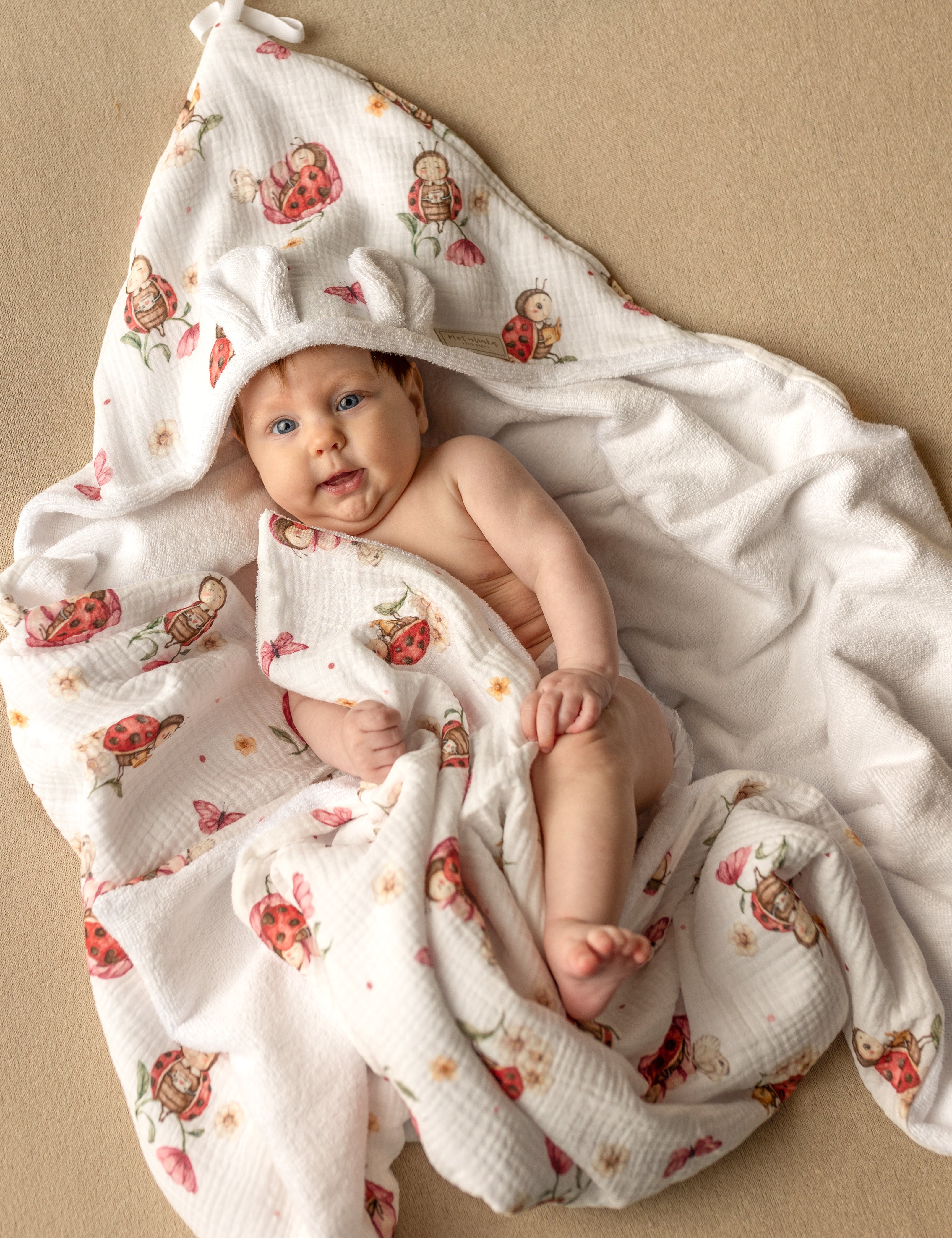 Wrap your baby in gentle comfort with our luxury bamboo baby towel. Made from bamboo terry and cotton muslin, it's hypoallergenic, and OEKO-TEX certified.
