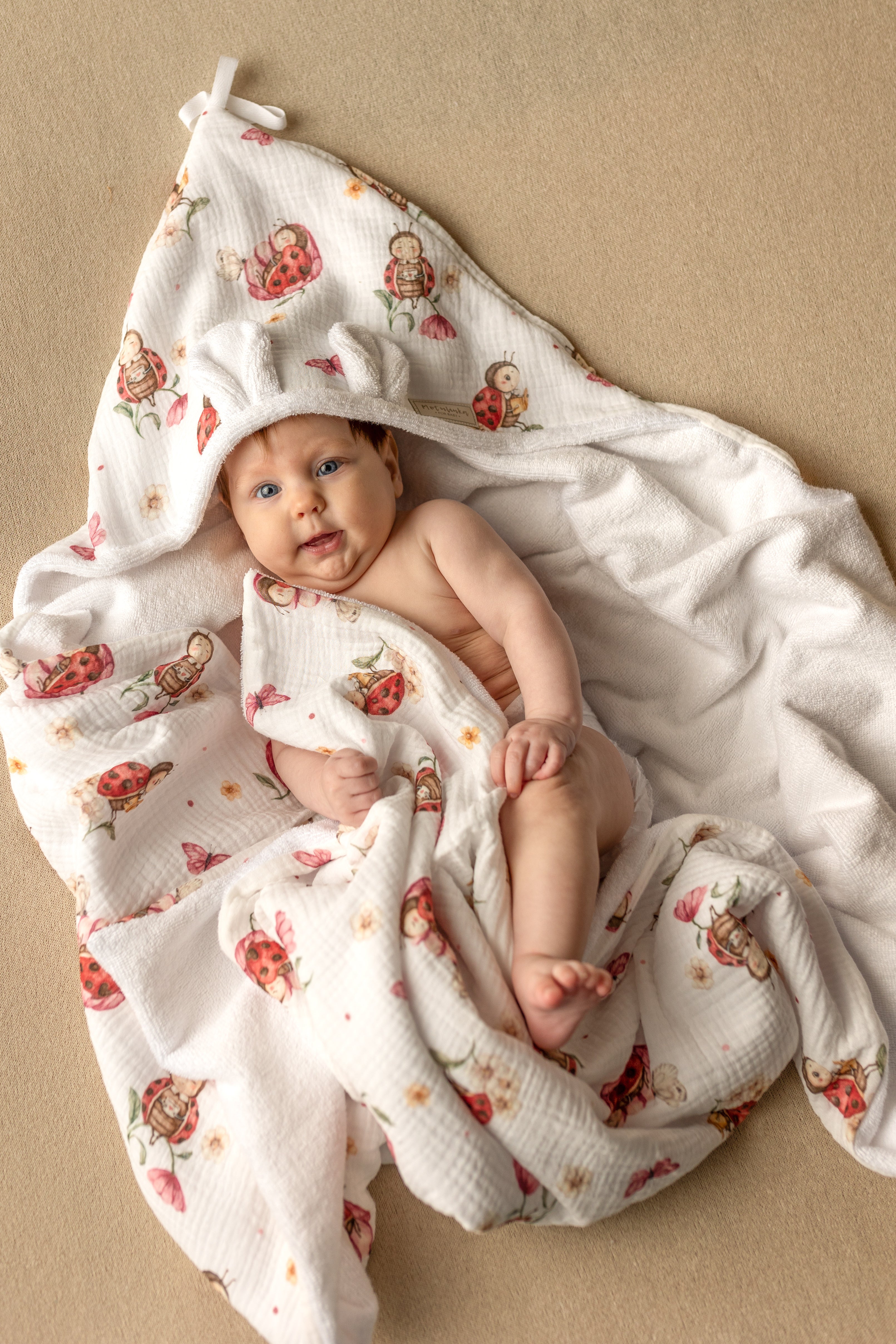 Wrap your baby in gentle comfort with our luxury bamboo baby towel. Made from bamboo terry and cotton muslin, it's hypoallergenic, and OEKO-TEX certified.
