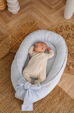 Discover our premium baby nest sleeper crafted with breathable linen and hypoallergenic fill. Provides a cozy, secure space for newborns.