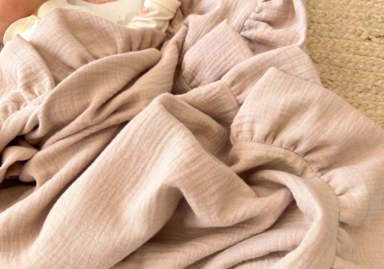 Wrap your baby in softness with our OEKO-TEX® certified muslin swaddle blanket. Ultra-lightweight, breathable, and gentle on sensitive skin. Shop muslin blanket