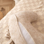 Decorative pillow with floral pattern on a textured surface