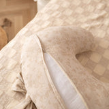 Decorative pillow with floral pattern on a textured surface