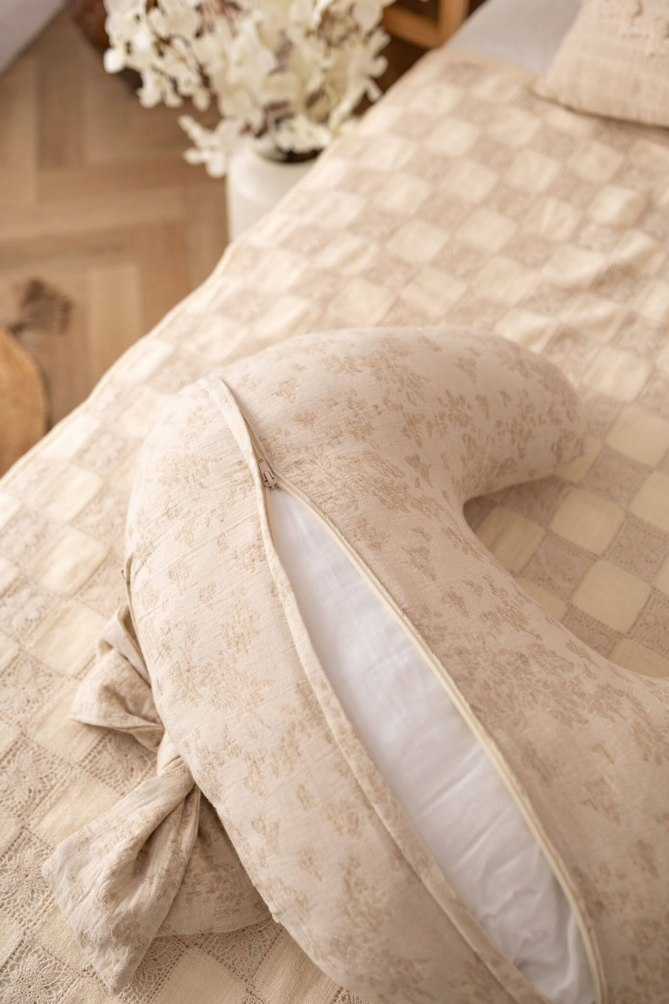 Decorative pillow with floral pattern on a textured surface