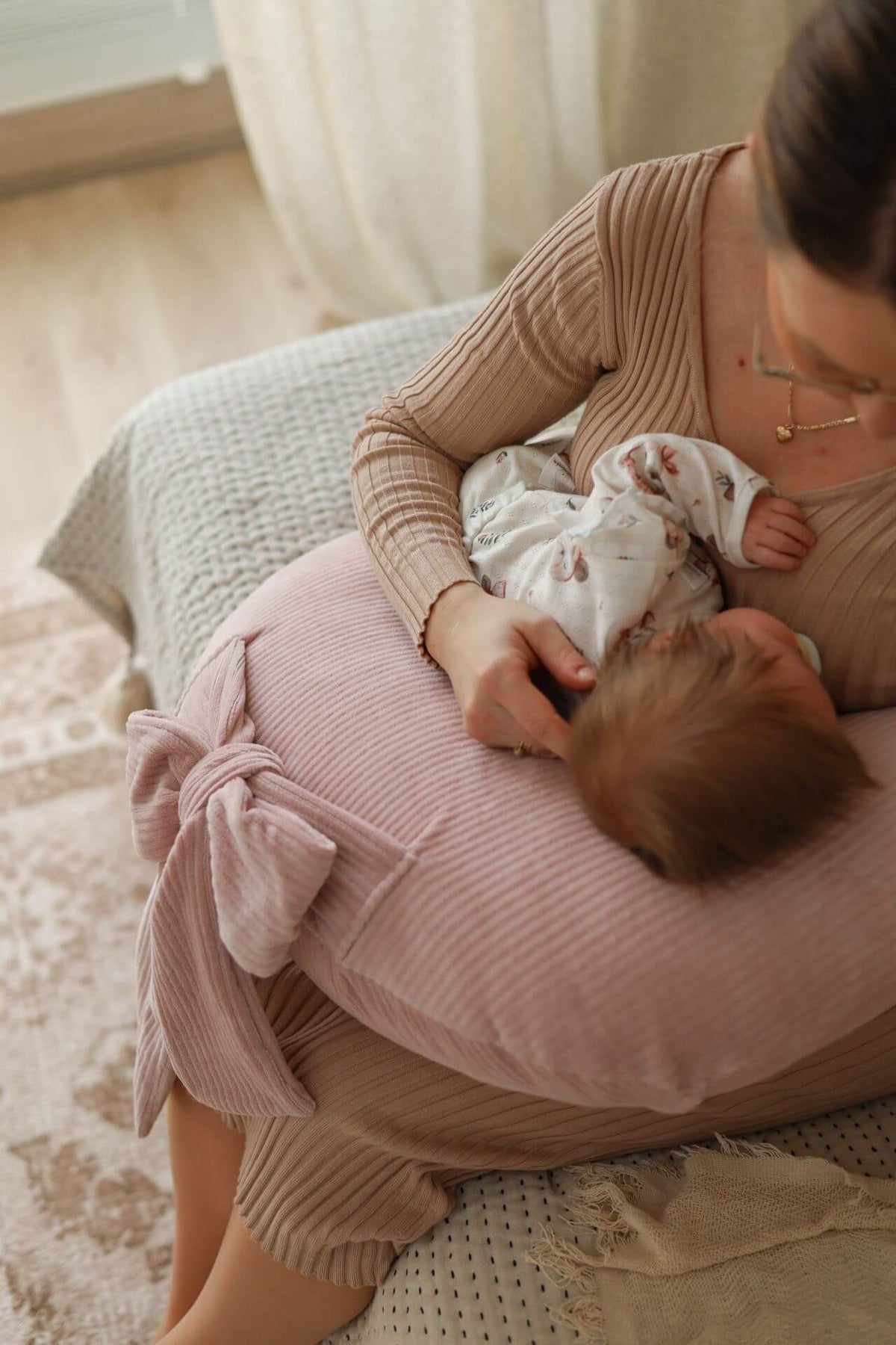 Experience effortless feeding with our Ultimate Comfort Nursing Pillow. Ergonomic design and plush fabric provide support for both baby and parent.
