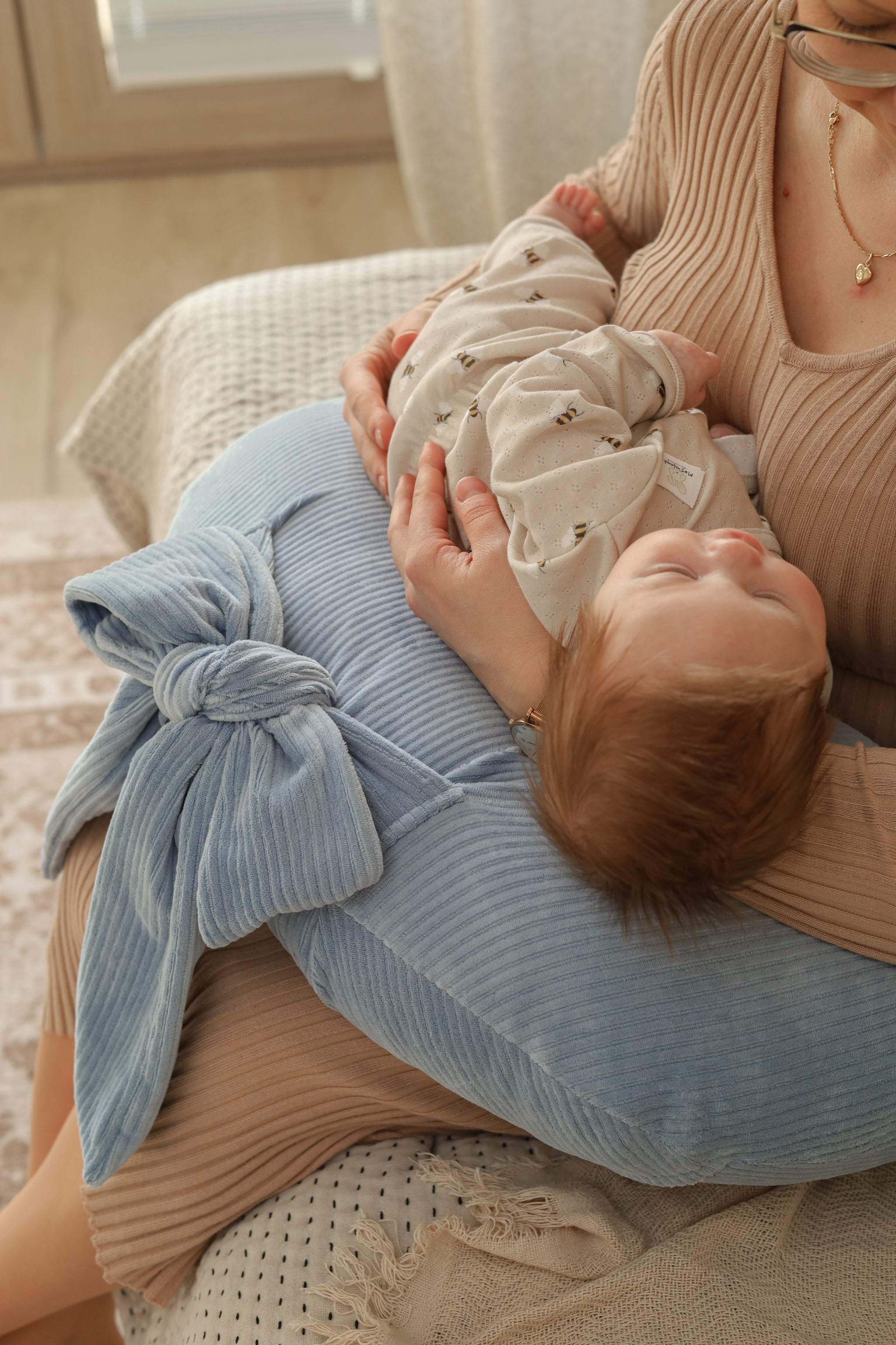Experience effortless feeding with our Ultimate Comfort Nursing Pillow. Ergonomic design and plush fabric provide support for both baby and parent.